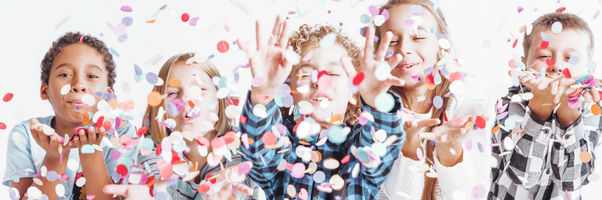 Group,Of,Smiling,Children,In,Casual,Clothes,Throwing,Confetti,Around